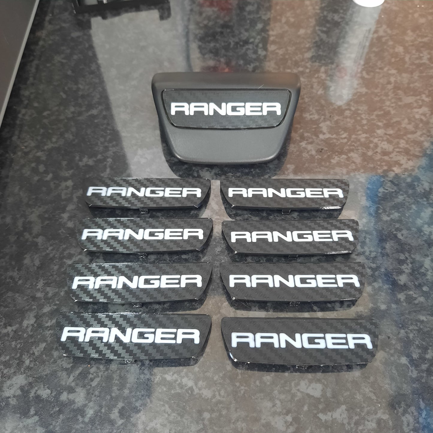 Set of 'RANGER' branded car accessories on a textured surface