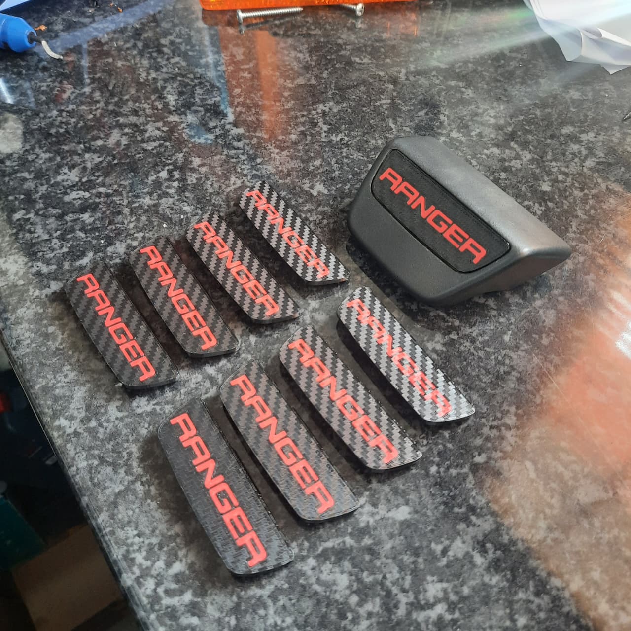 Red Ranger CF Pattern Enc Caps on a table