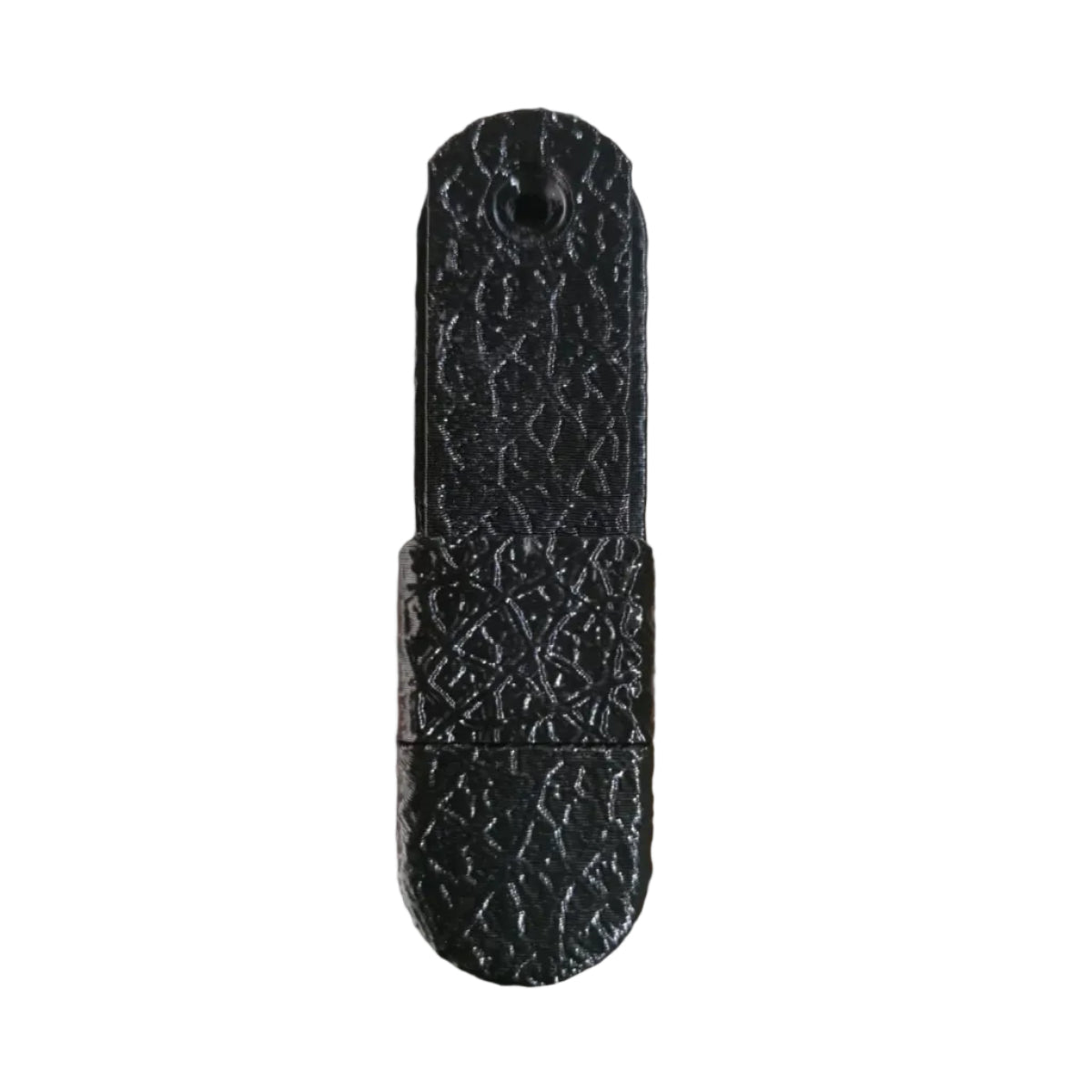 Black textured object on a wooden surface