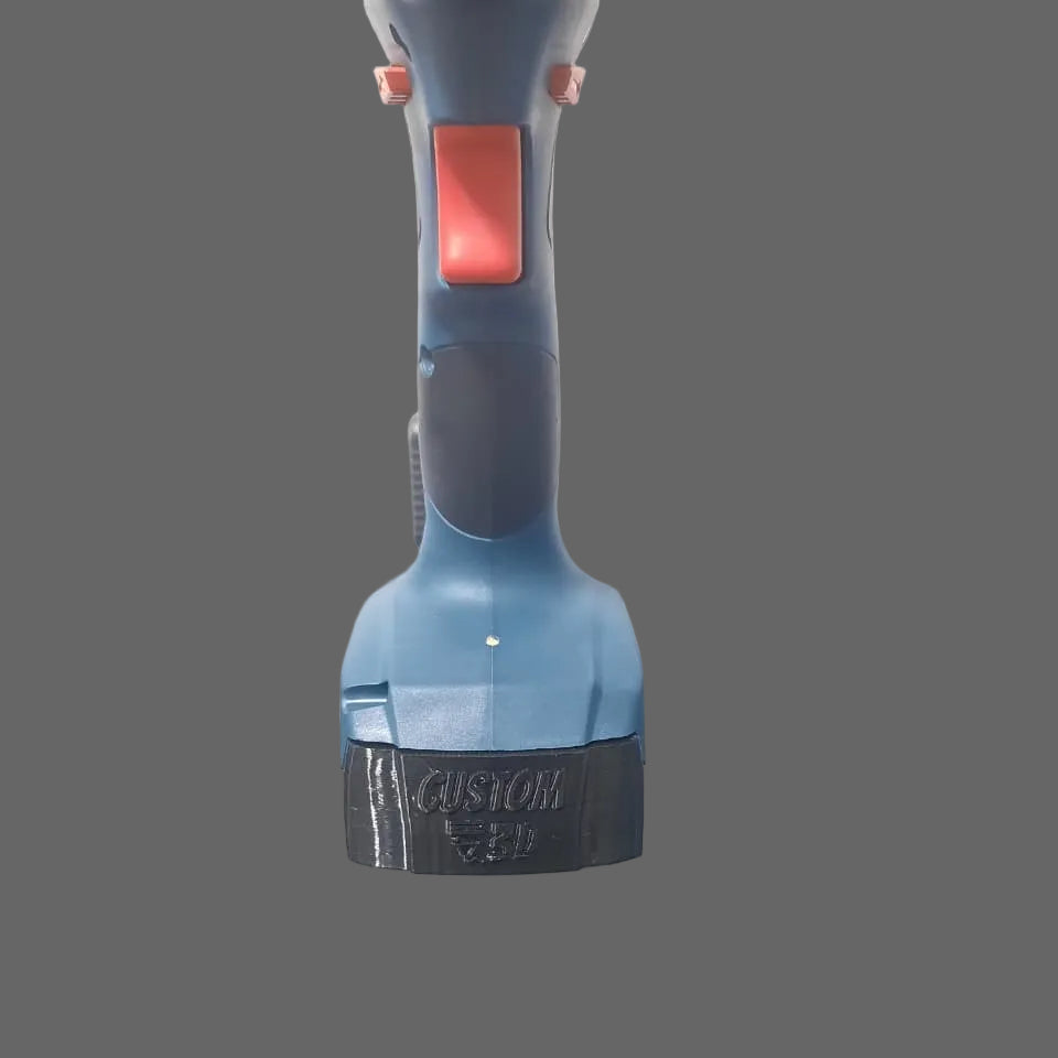 Blue and red handheld tool on a reflective surface with a grey background