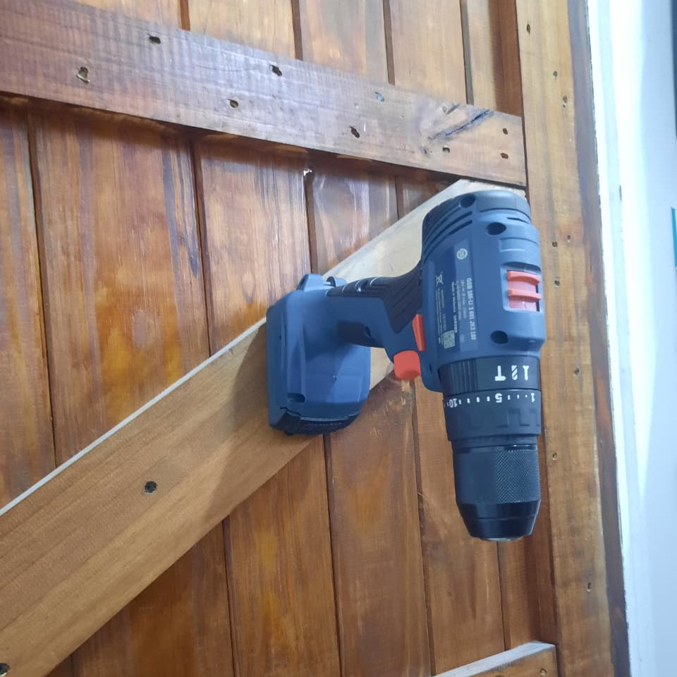 Power drill attached to a wooden surface
