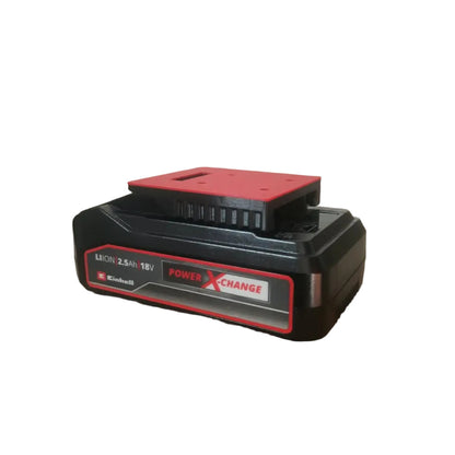 A Black+Deer Power XCharge 18V lithium-ion battery pack resting on a cardboard box in an indoor setting.