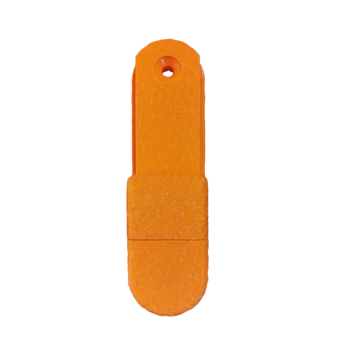 Orange plastic tool on a wooden surface