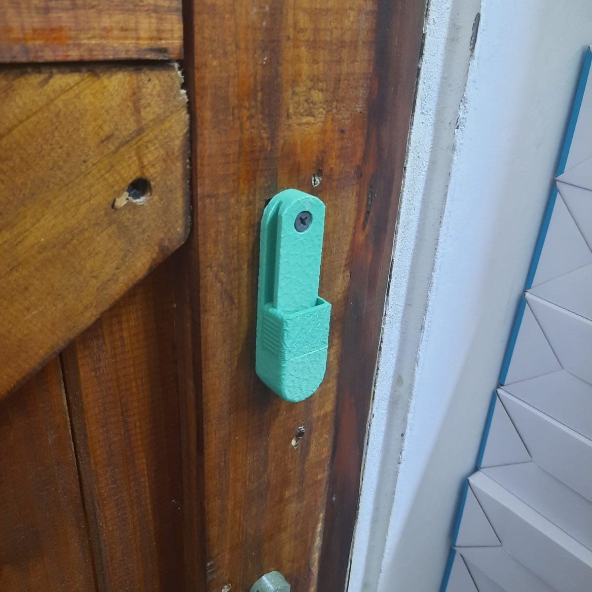 Green fishing reel wall mount