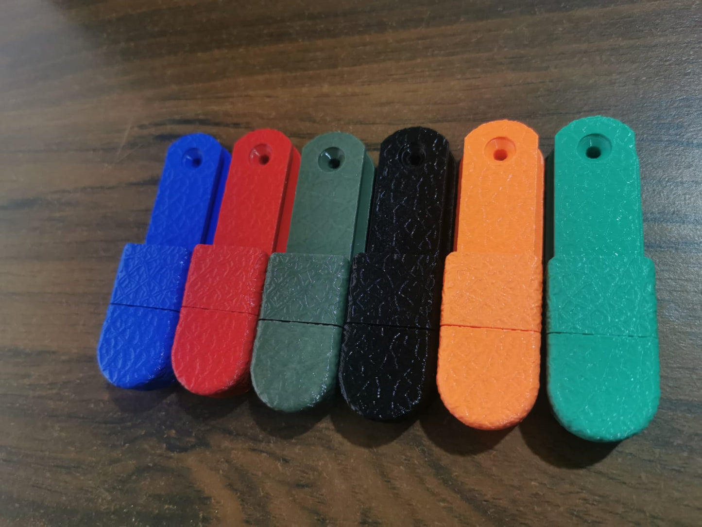 6 Different coloured fishing reel wall mounts