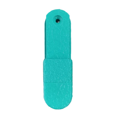 Mint Green plastic tool on a wooden surface