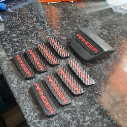 Red Ranger CF Pattern Enc Caps on a table